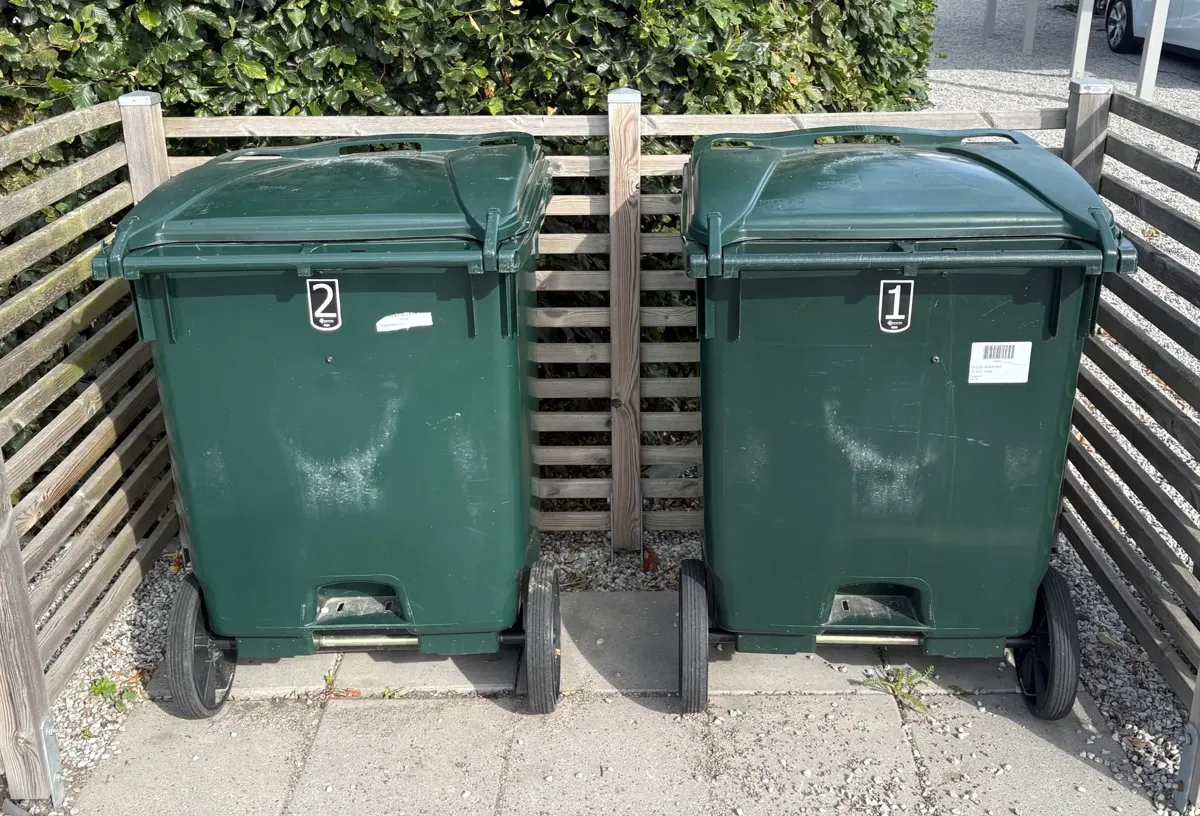 General waste bins next to the street, with bin number 1 marked.