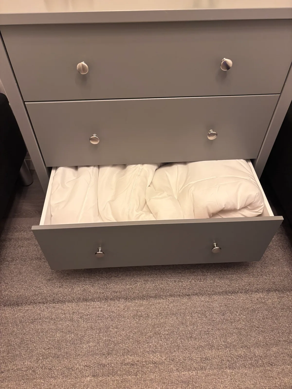 Pillows and duvets stored in the bottom drawer