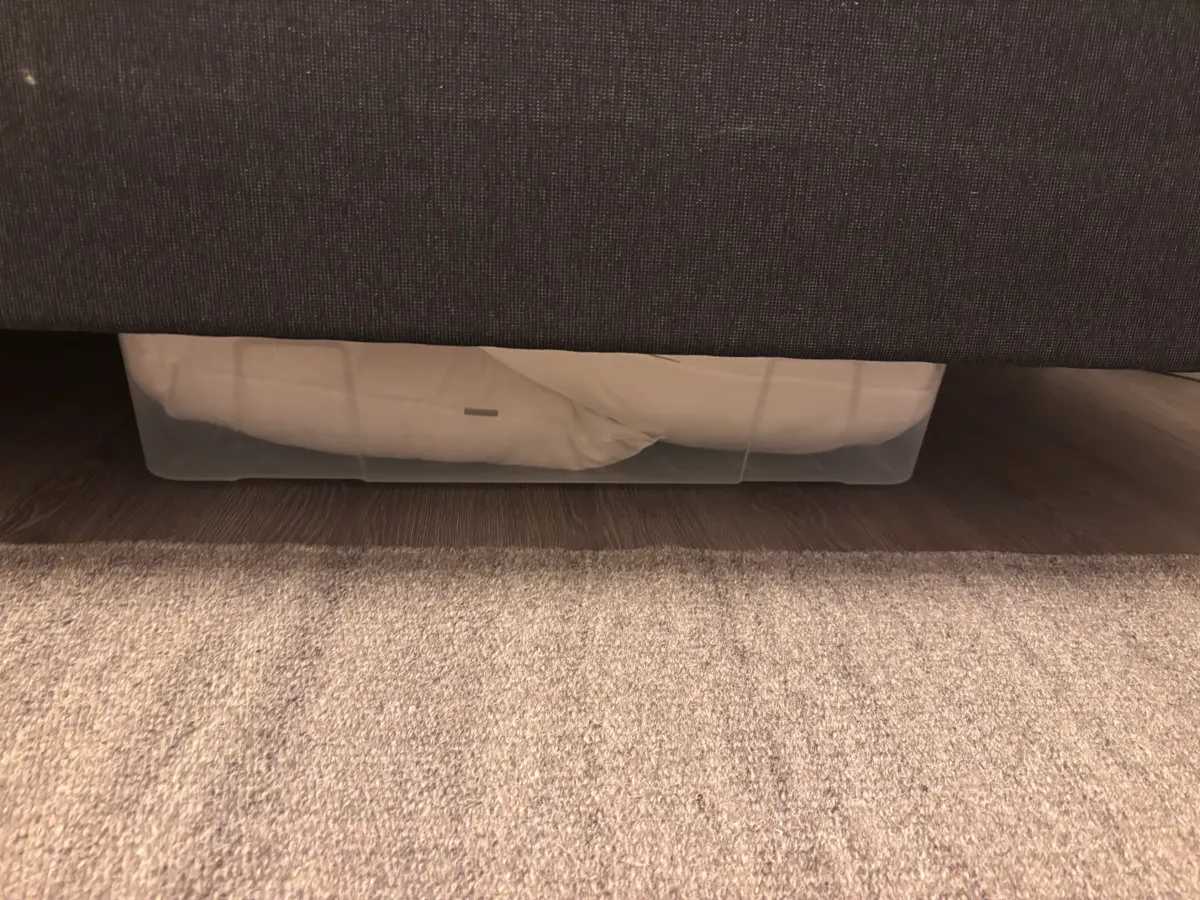 Pillows and duvets stored under the bed